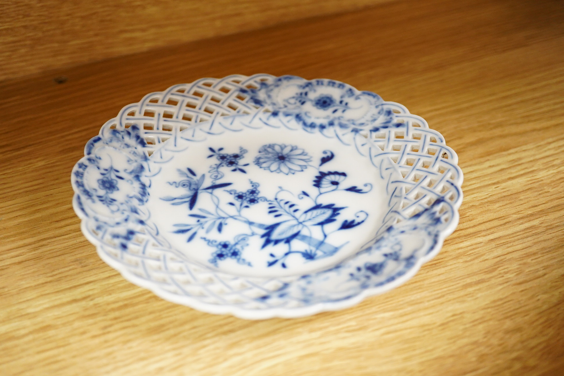 A collection of Coalport porcelain to include cups and saucers, a Meissen Pony, Meissen blue and white plate and a 19th century desk stand, largest 25cm wide